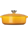 Side view of 3.5 qt Nectar Le Creuset Signature Round Wide Dutch Oven with a lid displayed on a white background