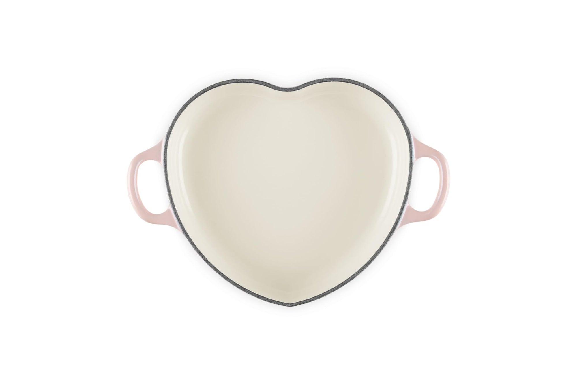 Top view of peche heart shaped 1.25 qt cocotte with handles displayed on a white background