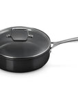 Le Creuset Essential Non-stick Ceramic 4.25 qt Sauté Pan with Lid and handles displayed on a white background