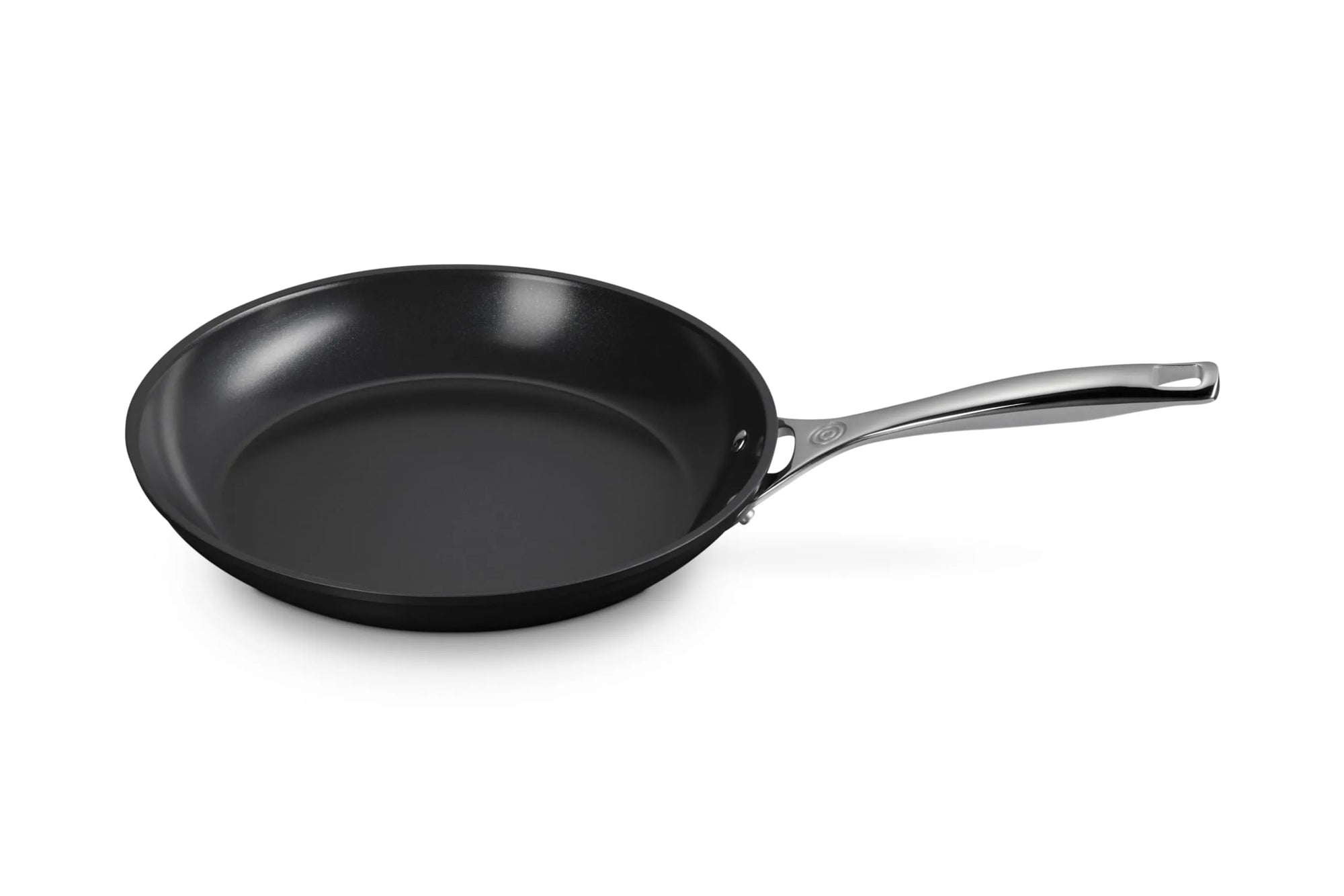 Le Creuset Essential Non-stick Ceramic 10" Fry Pan with a handle displayed on a white background