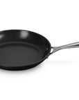 Le Creuset Essential Non-stick Ceramic 10" Fry Pan with a handle displayed on a white background