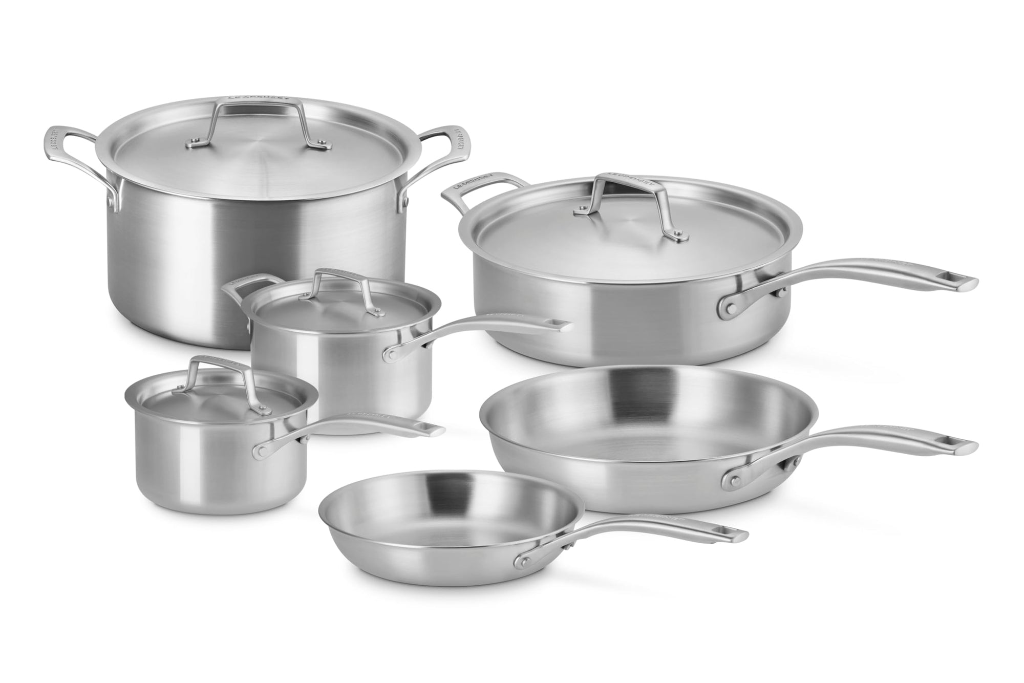 10 piece Le Creuset essential stainless steel cookware set displayed on a white background
