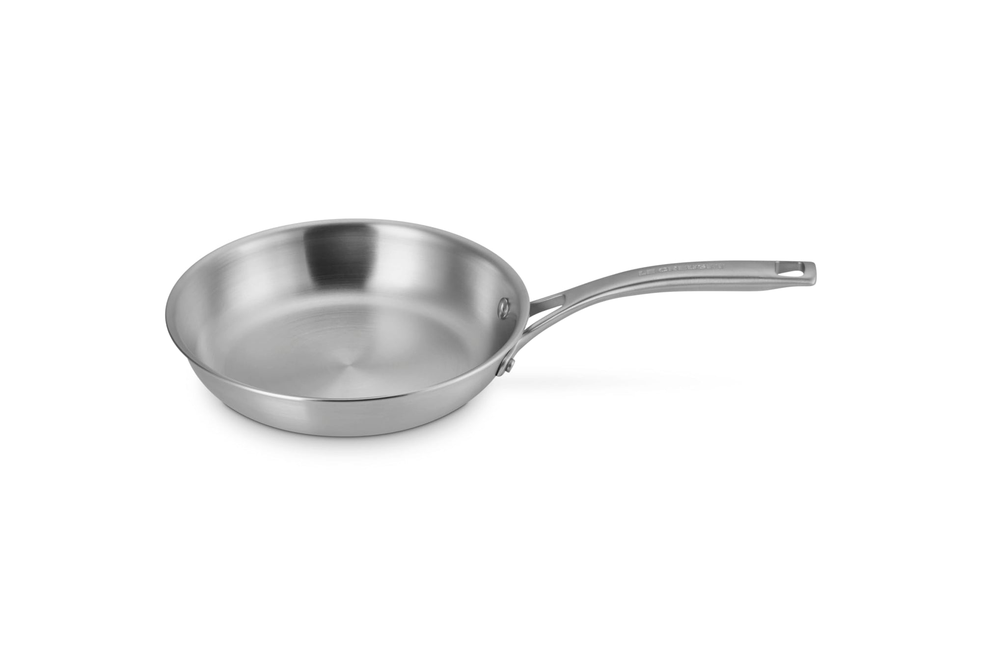 Le Creuset stainless saucepan with handles displayed on a white background