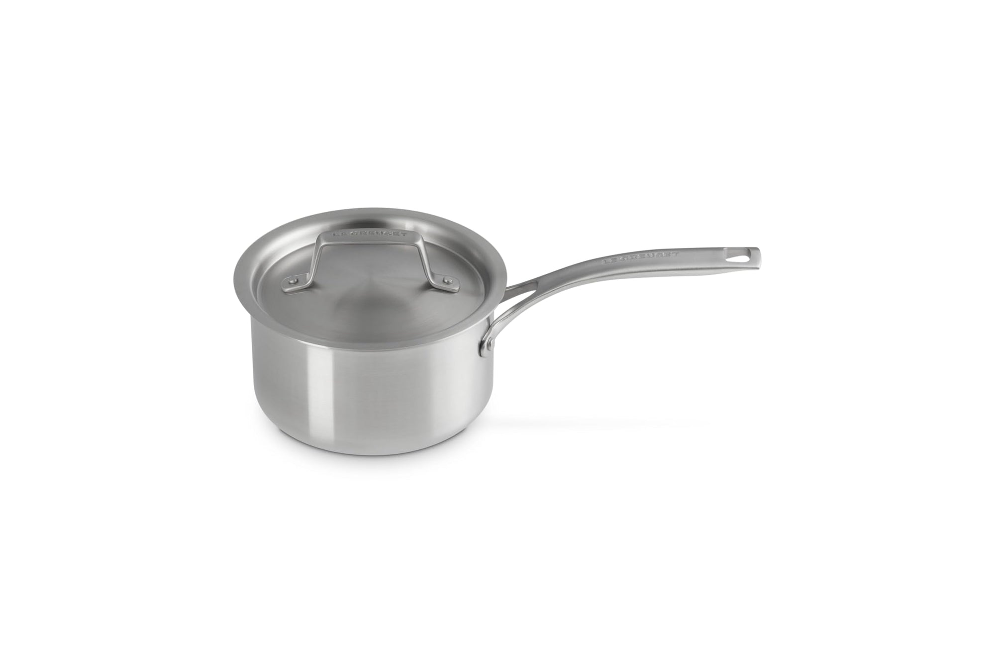Le Creuset stainless steel pot with handles and lid displayed on a white background