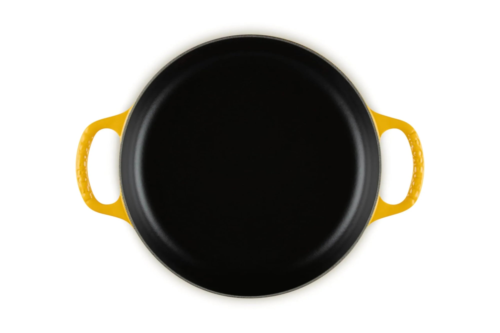 A top-down view of a round black cast iron skillet with bright yellow handles, isolated on a white background.