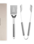 Set of barbecue tools with a carrying case on a white background