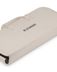 Beige travel bag with a visible brand logo on a white background