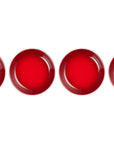 Four red circular objects on a white background
