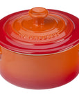 Flame Le Creuset Cocottes with lid displayed on a white background