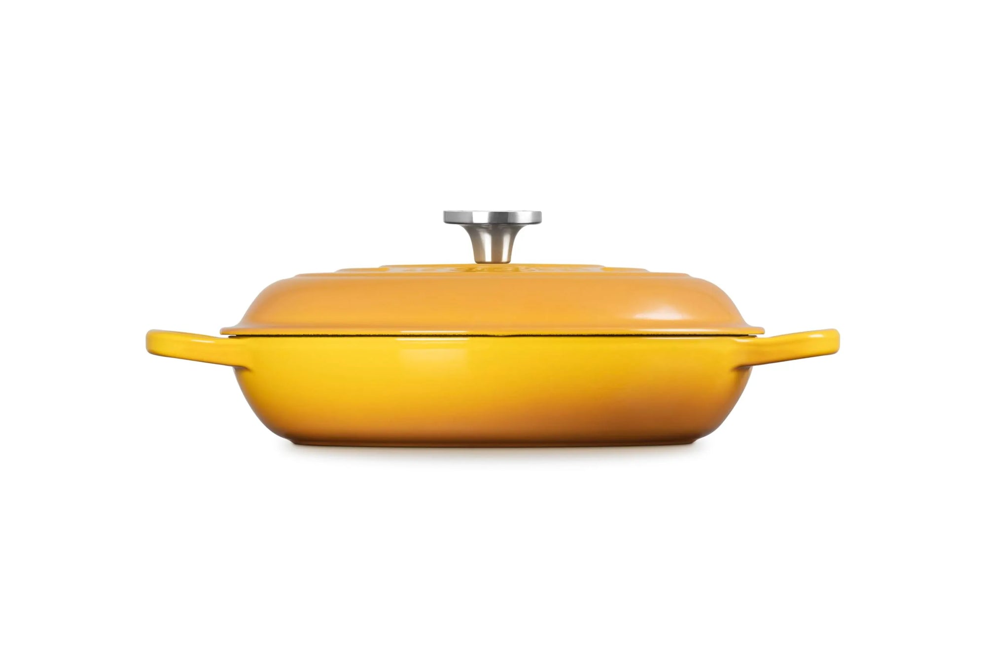 A yellow enameled cast iron Dutch oven with a matching lid and side handles, featuring a silver metal knob on top, shown against a plain white background.