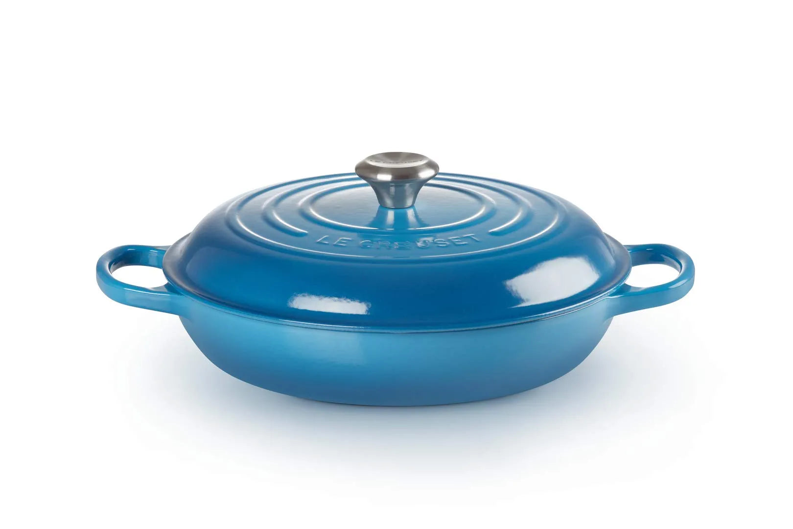 A blue enameled cast iron Dutch oven with a matching lid and silver metal knob, shown on a clean white background.