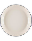 Round enamel pan with handles on a white background