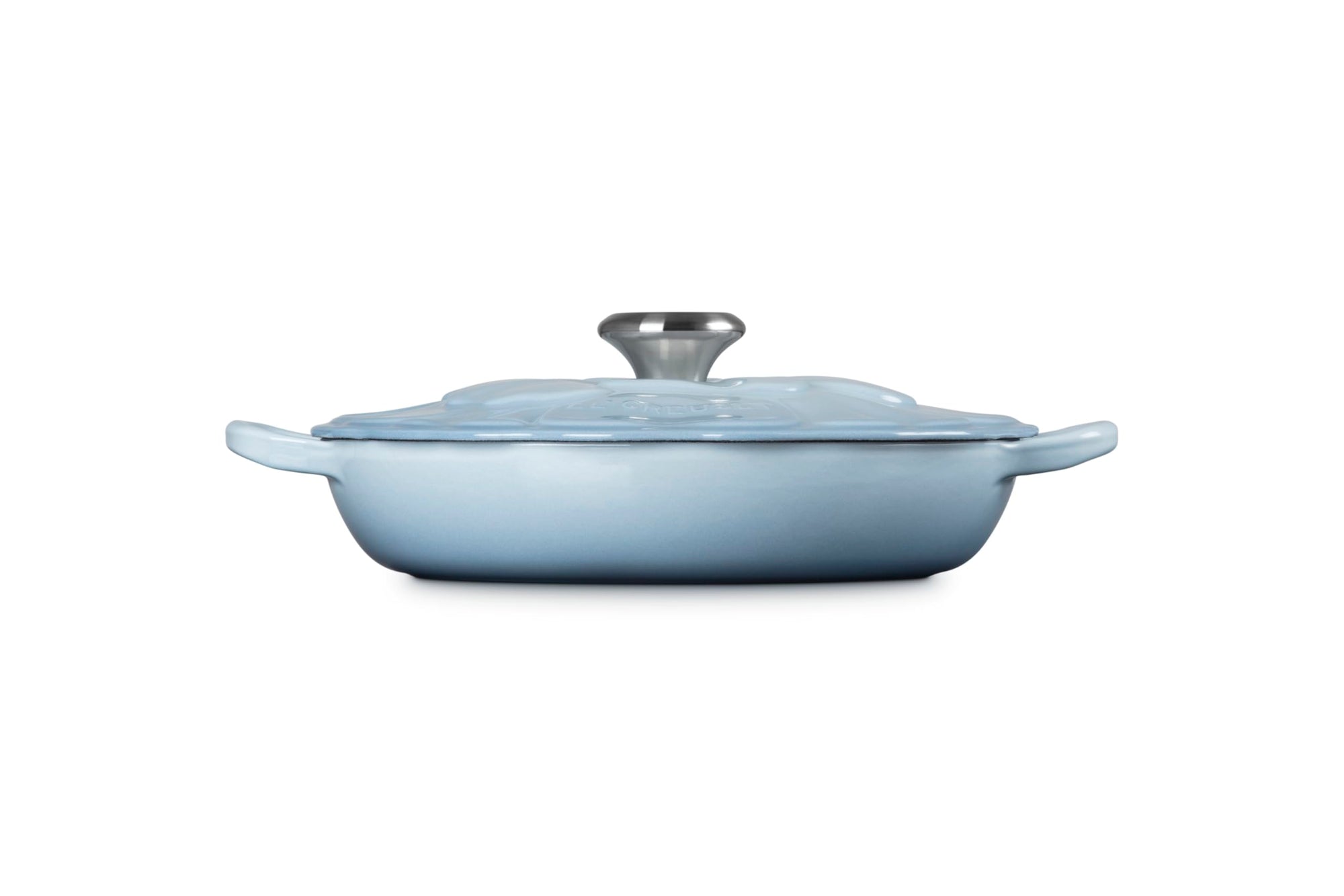 Light blue cast iron cookware with lid on a white background