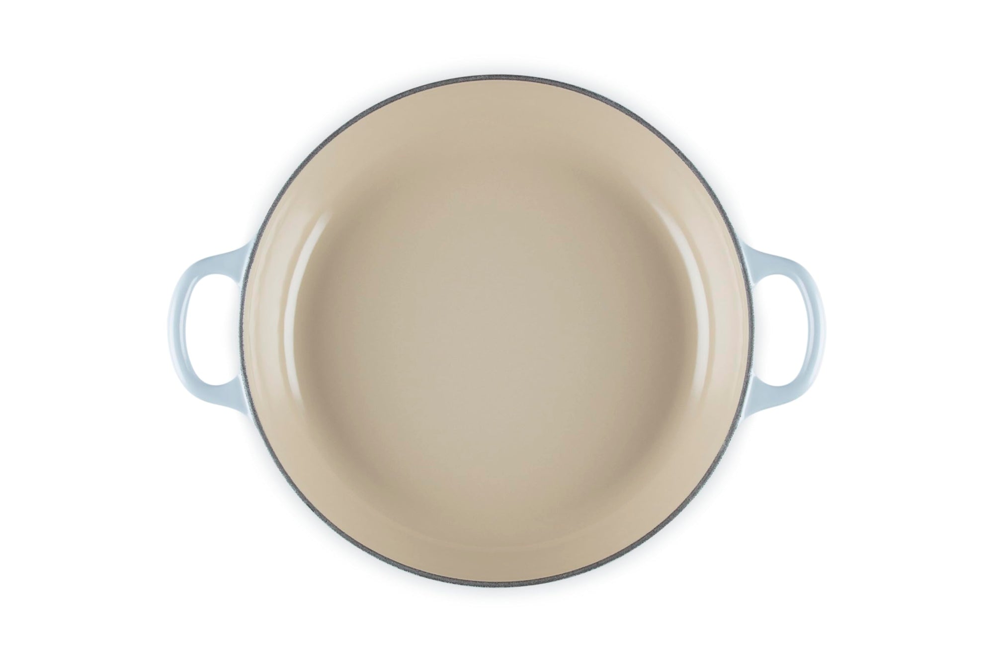 Beige enamel pan with blue handles on a white background