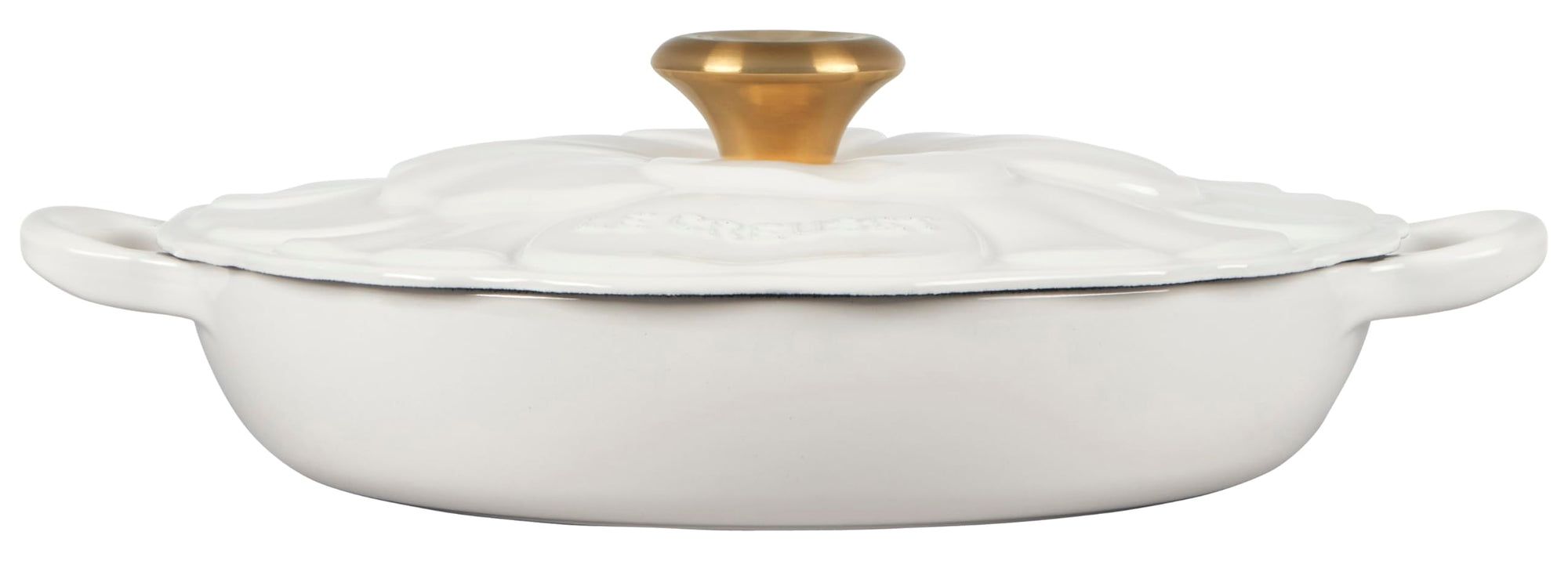 White ceramic dish with a gold knob on a white background