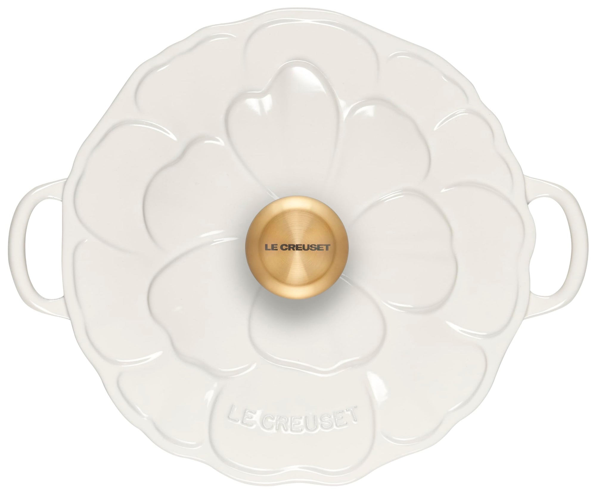 White ceramic dish with gold knob featuring 'Le Creuset' branding on a white background