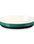 An oval ceramic baking dish with a glossy Artichaut exterior and a cream-colored interior, featuring small side handles, shown on a plain white background.