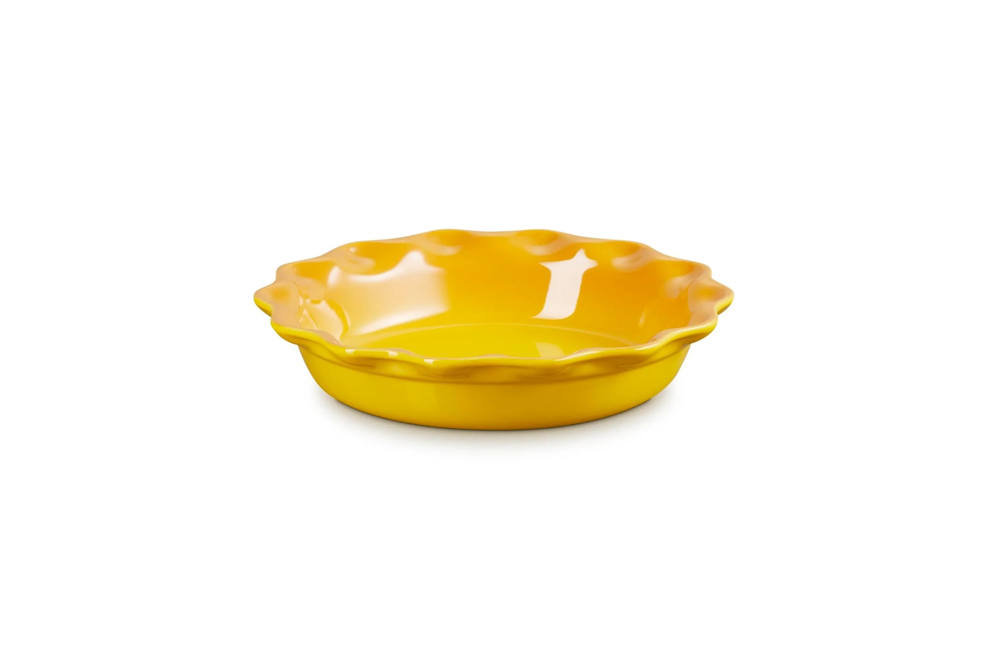 A bright yellow ceramic pie dish with a scalloped rim, shown on a clean white background.