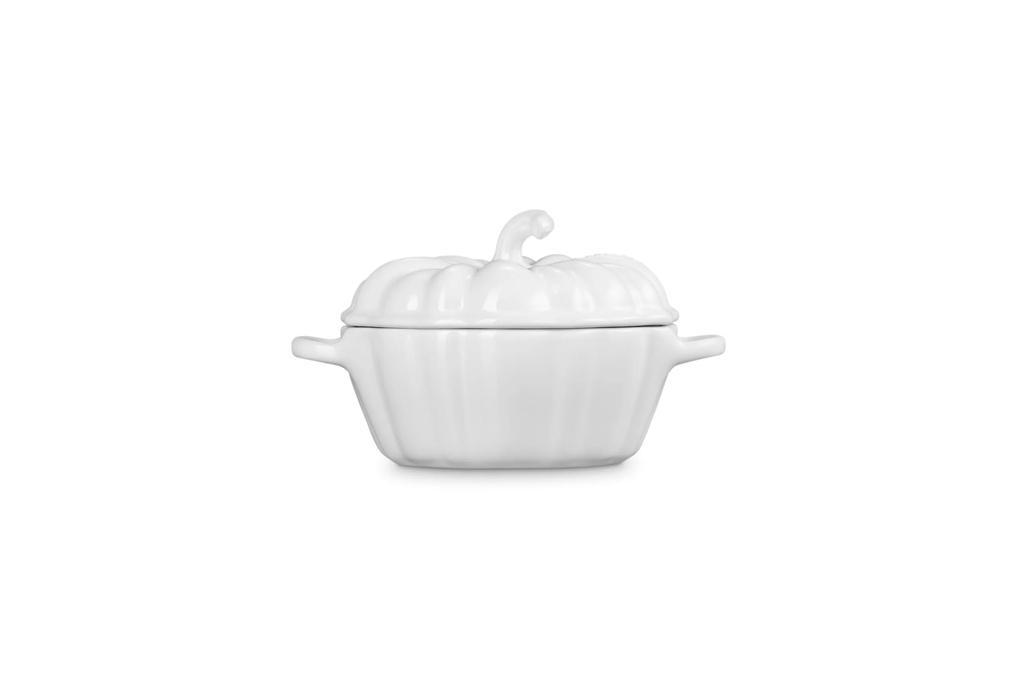Side view of a white cast-iron pumpkin-shaped lidded cocotte with side handles, shown on a plain white background.