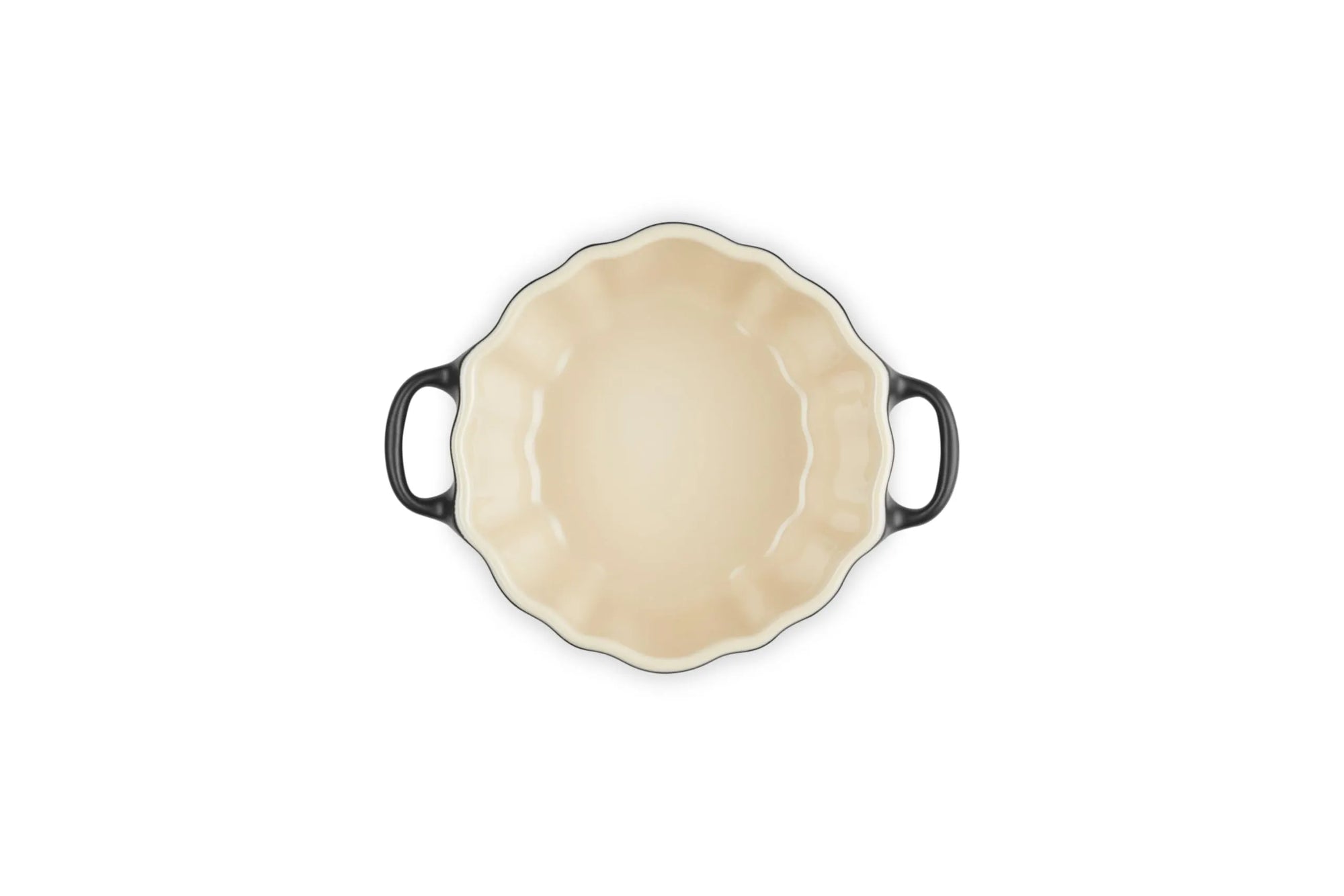 An oval baking dish with a cream-colored interior and dark gray handles, shown from a top-down view on a white background.