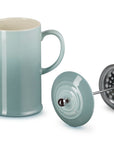 Sea Salt Le Creuset Stoneware French Press, 34 oz. with attachment on the side displayed on a white background