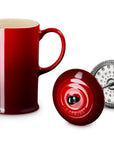 Cerise Le Creuset Stoneware French Press, 34 oz. with attachment on the side displayed on a white background