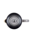 Top-down view of a Le Creuset French press with a dark gray exterior, with grayish lid, and a light gray handle on a white background.