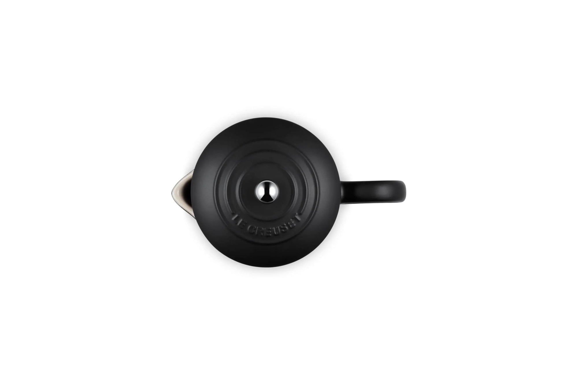 A matte black Le Creuset French press viewed from a top-down angle on a solid white background.