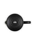 A matte black Le Creuset French press viewed from a top-down angle on a solid white background.
