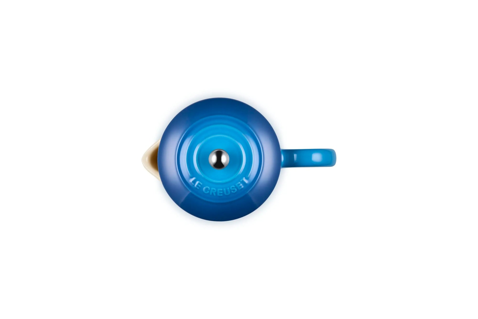 Top-down view of a Le Creuset enameled French press in a vibrant blue color, showing the lid, spout, and handle against a solid white background.