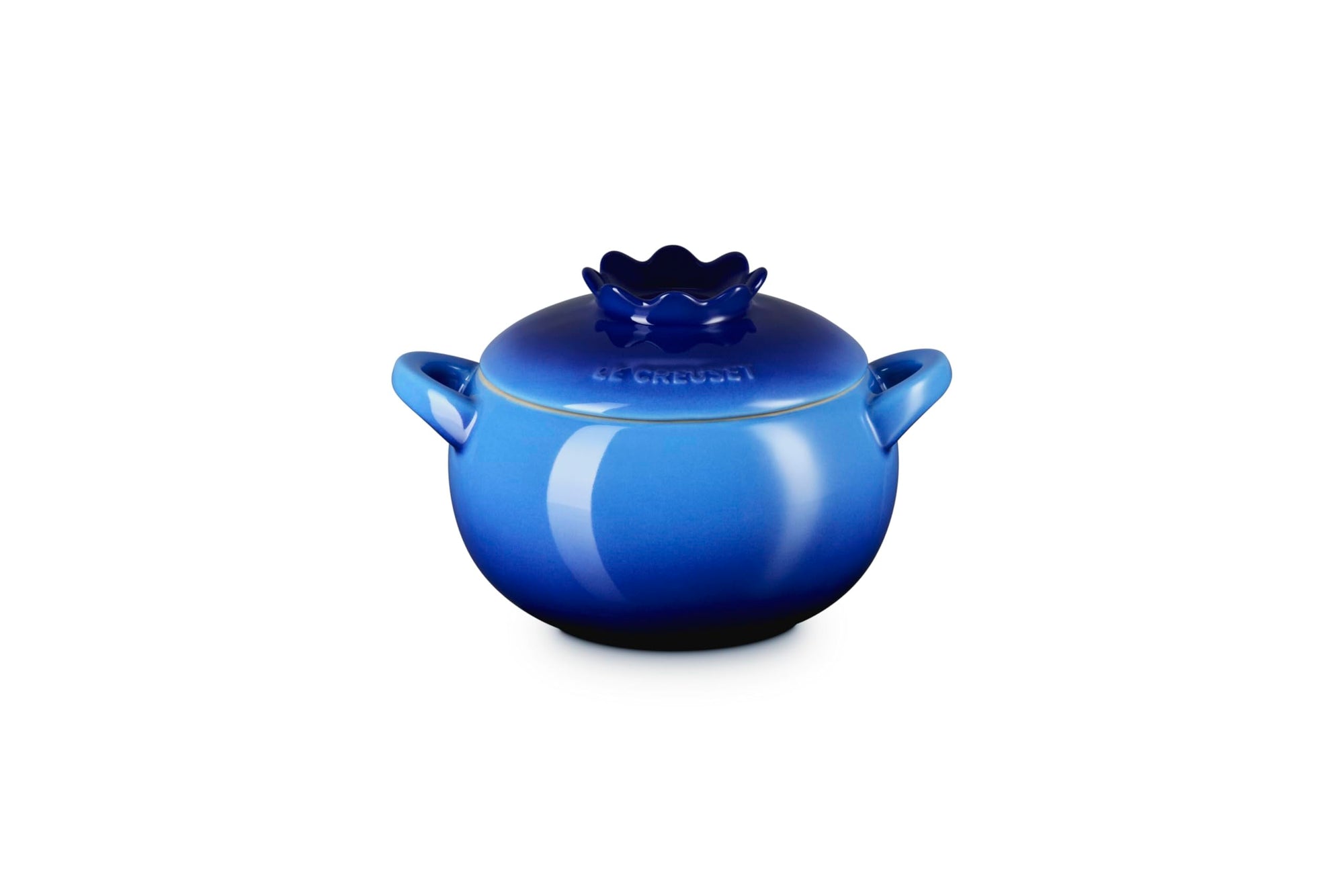 Side view of blue ceramic pot with lid that looks like a blueberry on a white background