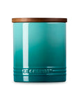 Front view of Riviera 16oz Le Creuset Stoneware Signature Canister with a wood lid on a white background