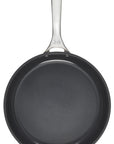 Top view of black frying pan with a silver handle on a white background