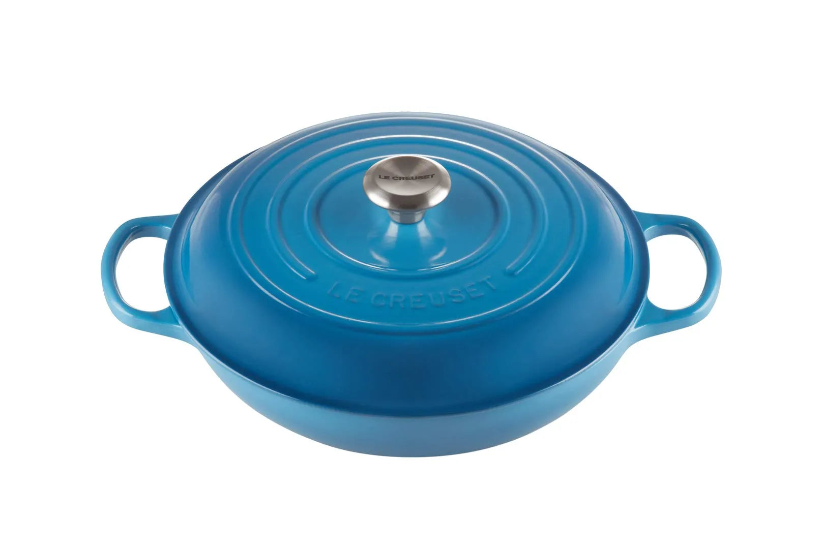 A Le Creuset blue enameled cast iron pot with a matching lid, featuring side handles and a silver knob, shown on a solid white background.