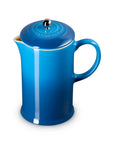 A vibrant blue enameled metal French press coffee maker with a matching lid, shown on a clean white background.