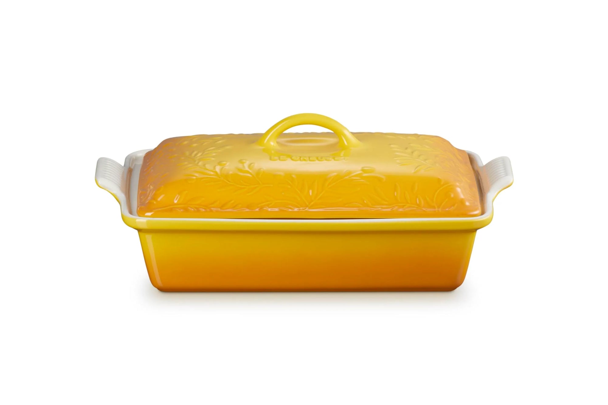 A yellow rectangular casserole dish with a matching lid, featuring white side handles and a floral embossed pattern on the lid, set against a plain white background.