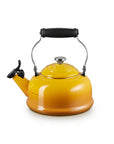 A glossy yellow-orange enamel kettle with a black handle and spout lever, isolated on a white background.