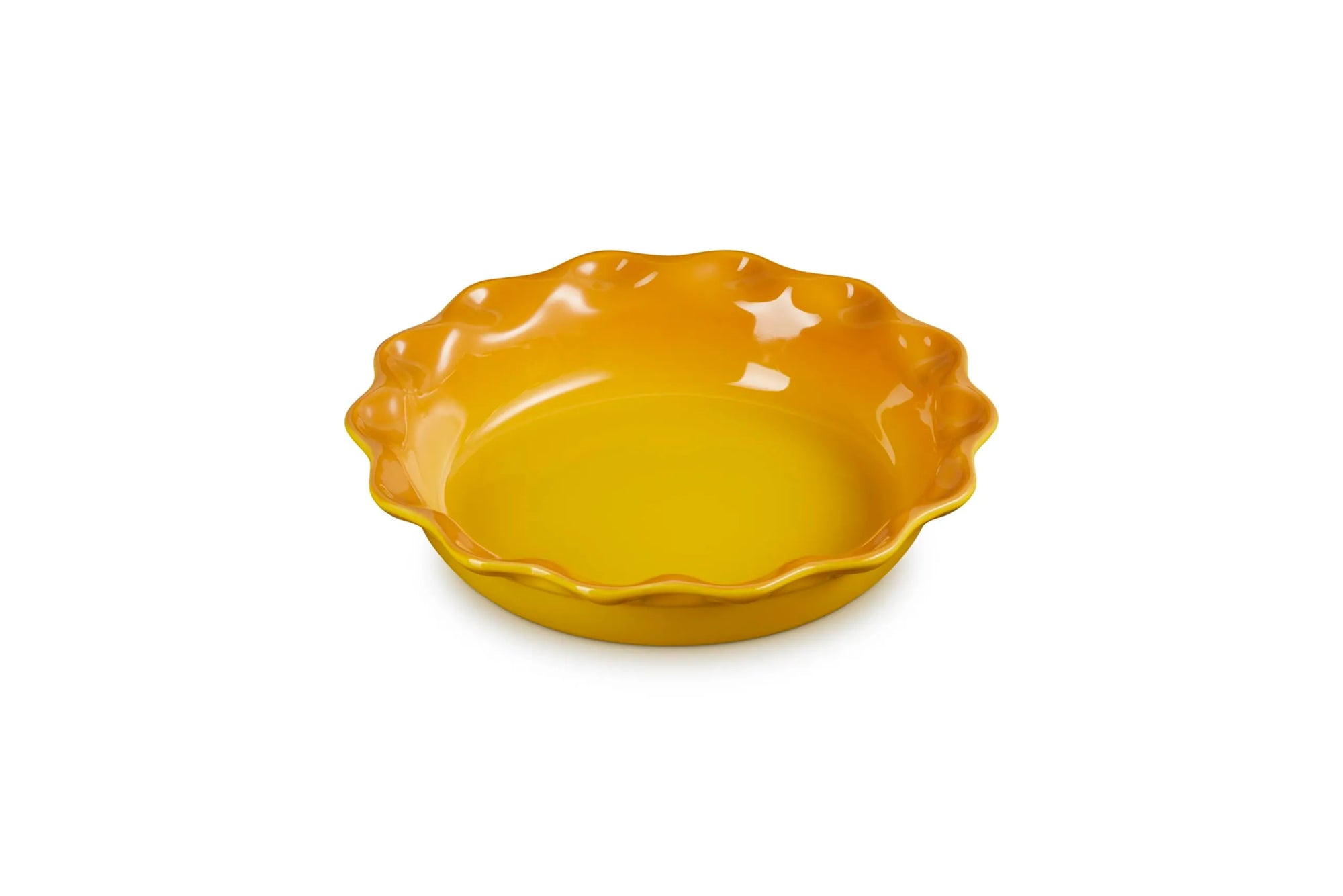 A small yellow ceramic pie dish with a scalloped rim, shown on a plain white background.