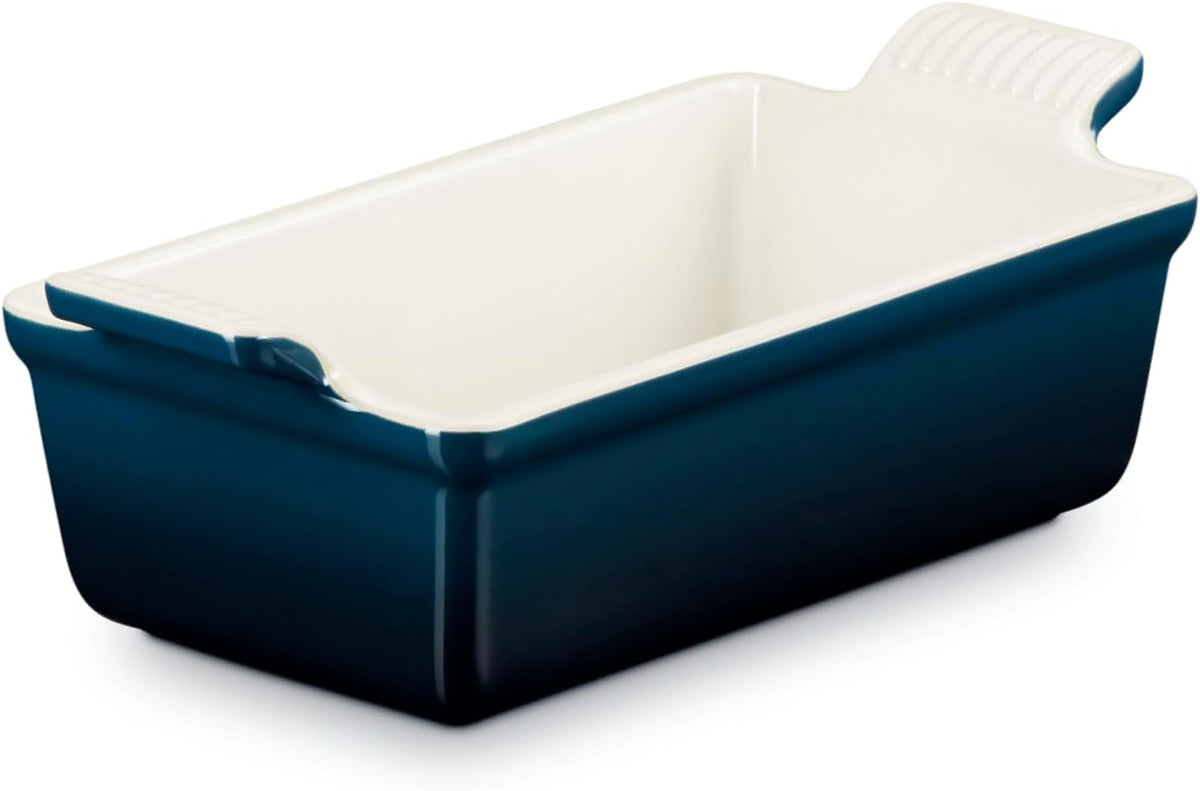 Dark blue Le Creuset 1.5 qt stoneware heritage loaf pan displayed on a white background