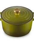 Olive Le Creuset Dutch oven on a white background