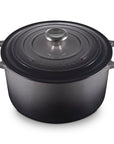 Oyster cast iron round oven with handles and lid displayed on a white background
