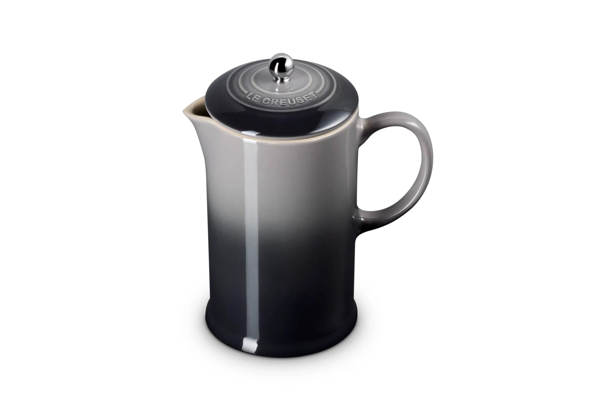 A ceramic French press coffee maker with a black and gray gradient design, featuring a matching black lid with a silver metal knob and a white Le Creuset logo embossed on the lid.