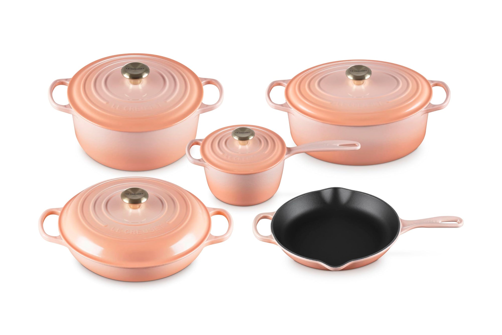 Set of 5 peche cookware with lids  on a white background