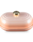 Peche bread oven pan with lid and handles displayed on a white background