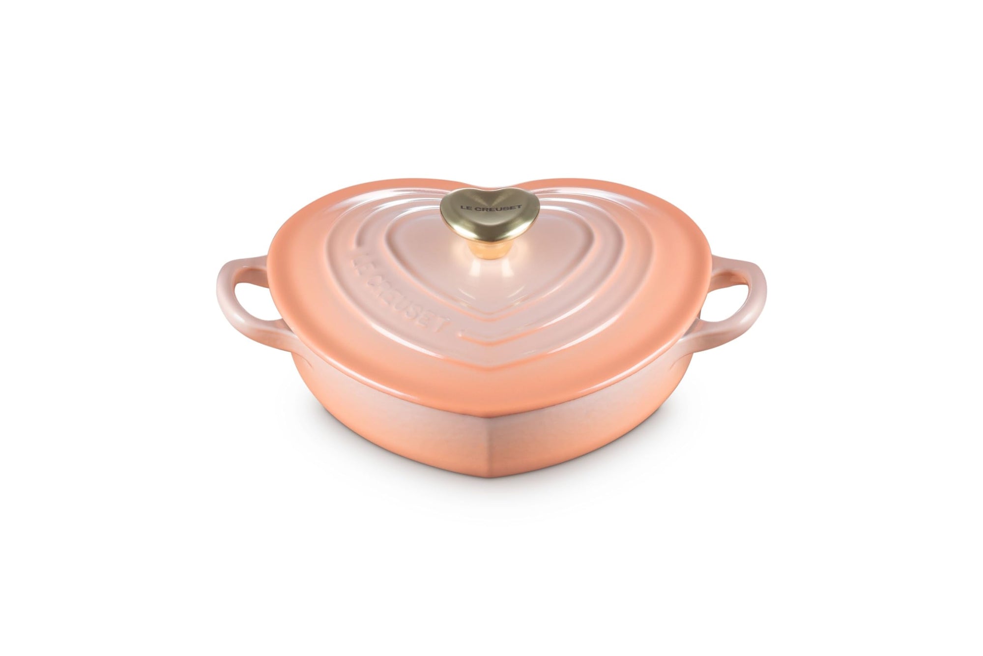 Peche heart shaped 1.25 qt cocotte with handles and a light gold heart knob displayed on a white background