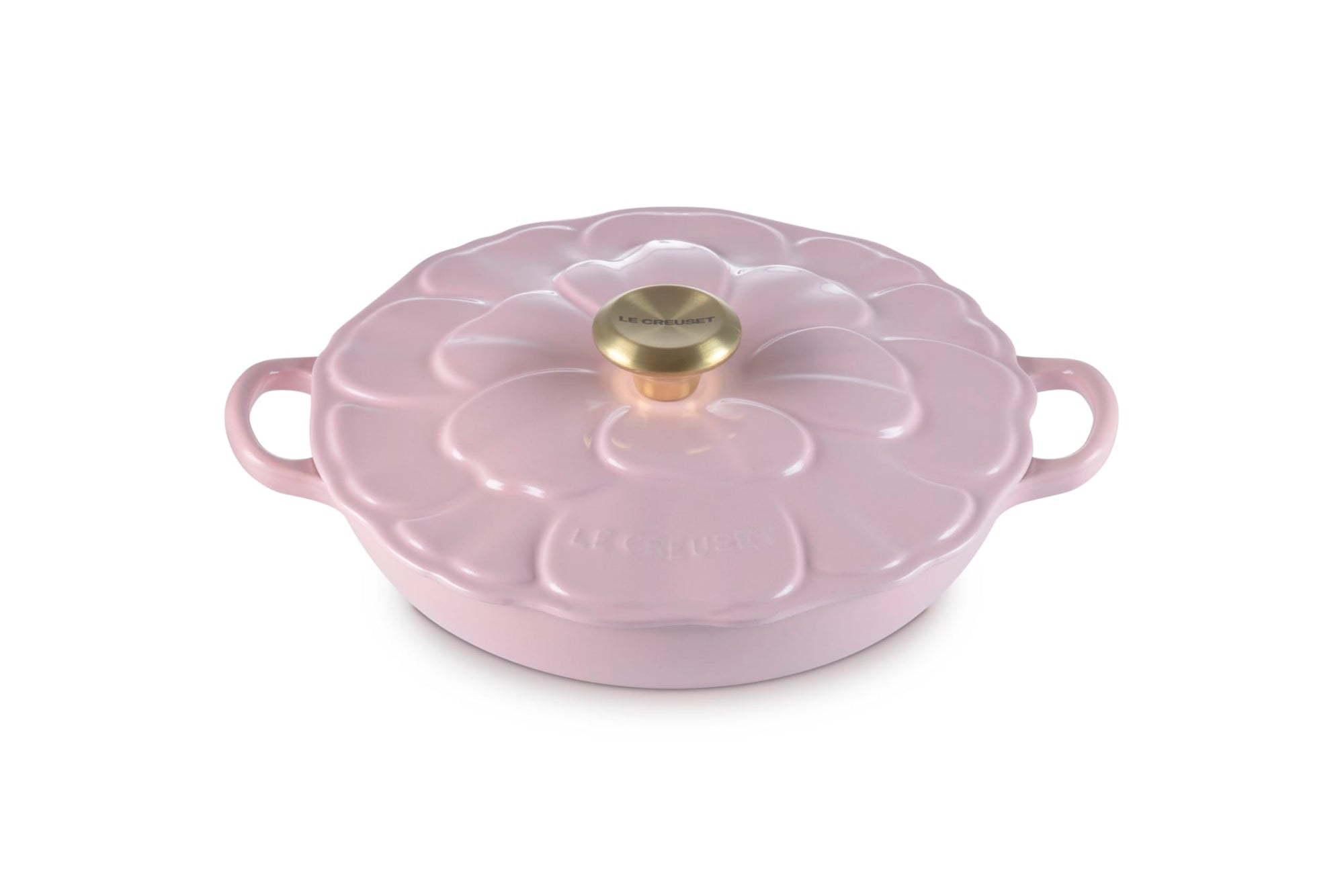 Pink ceramic cookware with floral design on a white background