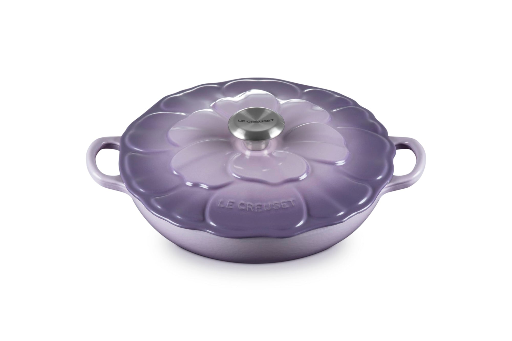 Purple cookware with floral lid on a white background