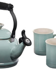 Sea salt tea kettle and two seasalt colored mugs on a white background