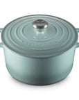Sea salt cast iron round oven with handles and lid displayed on a white background