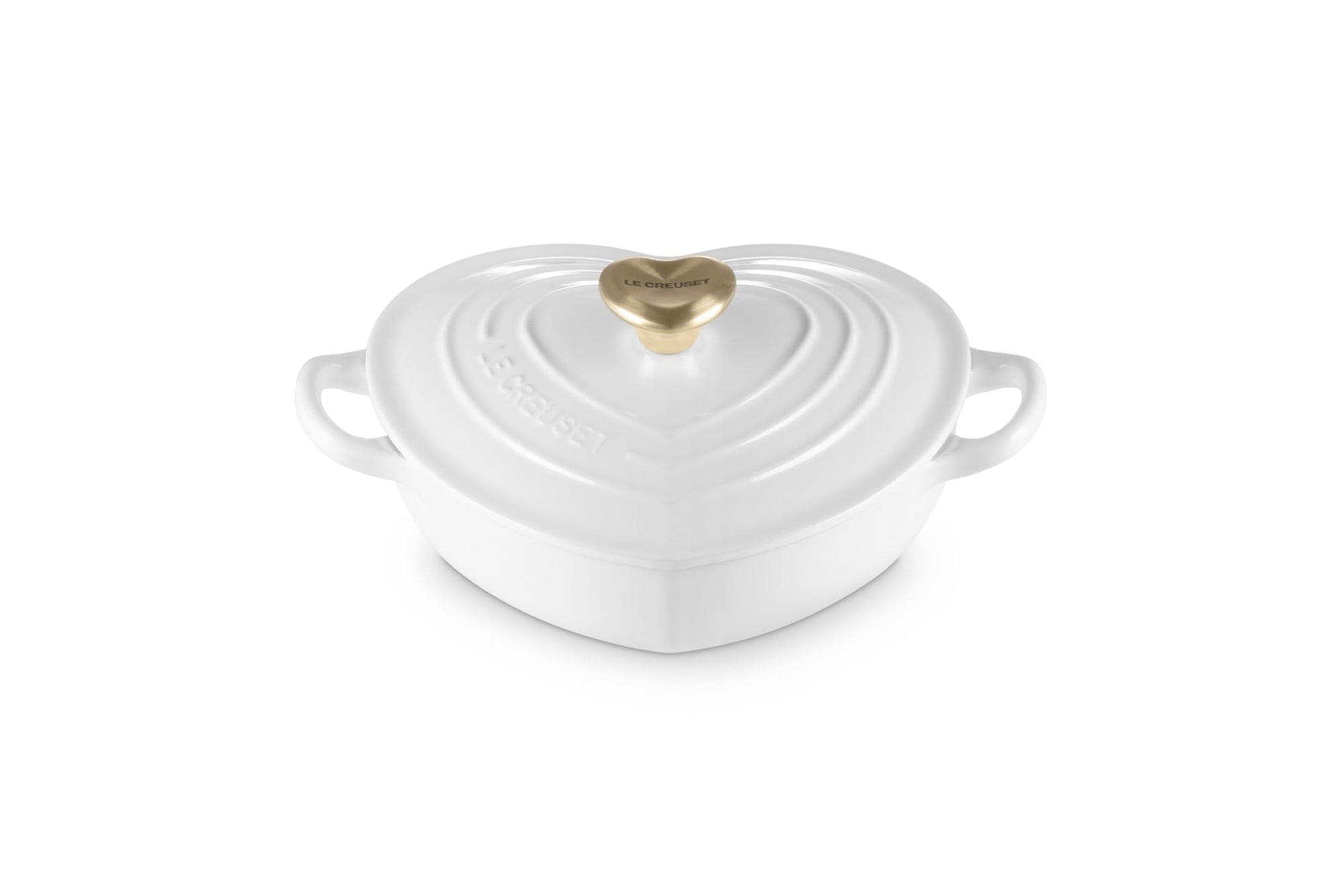 White heart shaped 1.25 qt cocotte with handles and a light gold heart knob displayed on a white background
